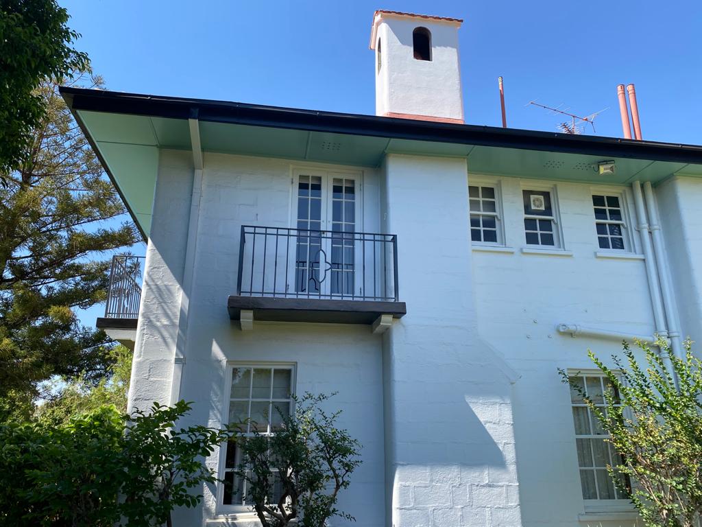 A white house with a balcony and chimney — North West Queensland Painting