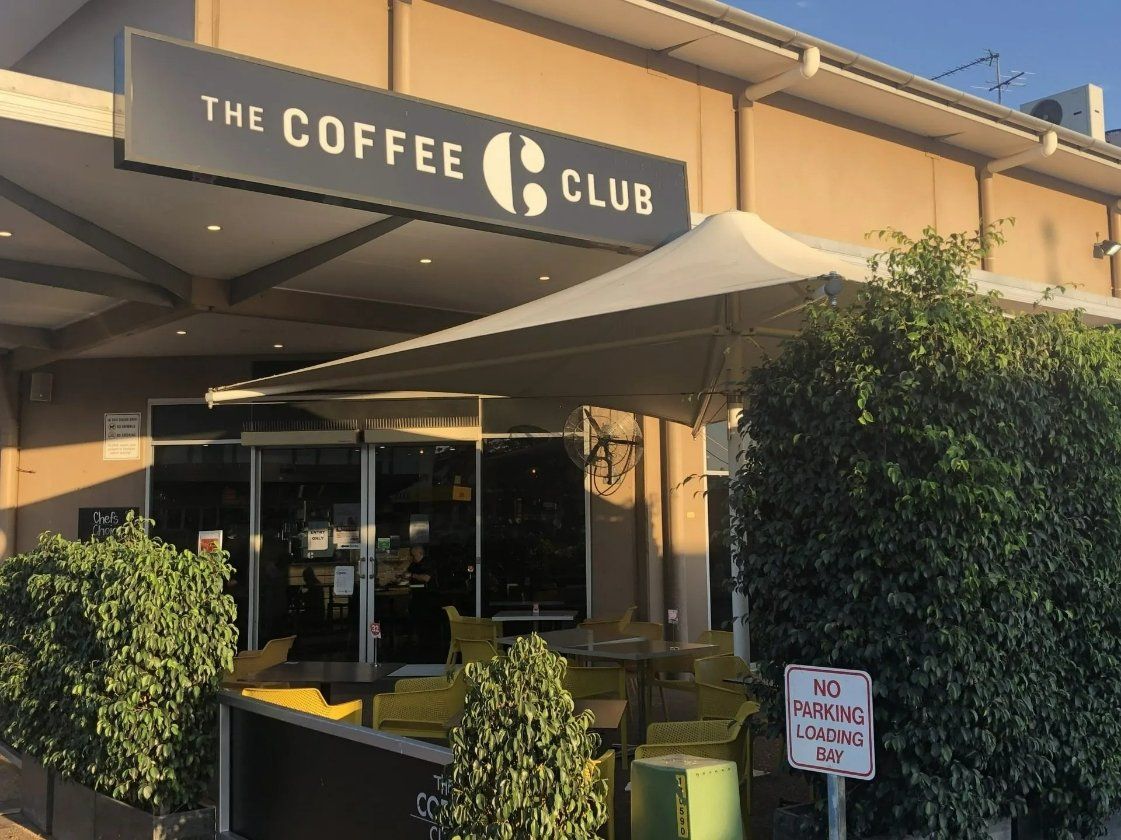 A building with a sign that says The Coffee Club — North West Queensland Painting